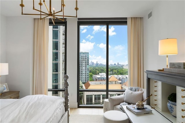 3107 Peachtree Rd NE Unit 1403, Atlanta, GA 30305 - bedroom with a chandelier, a view of city, visible vents, and access to exterior