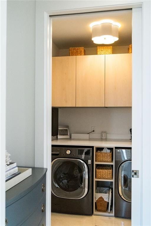 3107 Peachtree Rd NE Unit 1403, Atlanta, GA 30305 - laundry area featuring independent washer and dryer and cabinet space