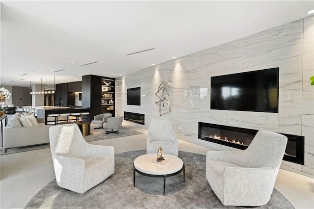 3107 Peachtree Rd NE Unit 1403, Atlanta, GA 30305 - living area featuring built in features, recessed lighting, and a fireplace