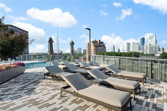3107 Peachtree Rd NE Unit 1403, Atlanta, GA 30305 - view of patio / terrace featuring a community pool and a city view