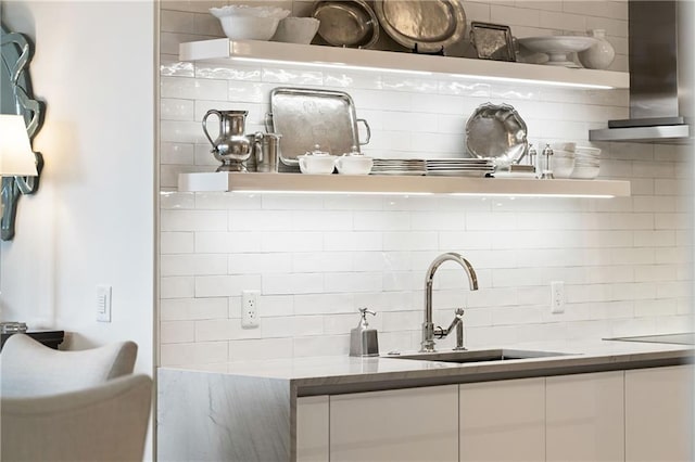 3107 Peachtree Rd NE Unit 1403, Atlanta, GA 30305 - kitchen with a sink, wall chimney range hood, decorative backsplash, and open shelves