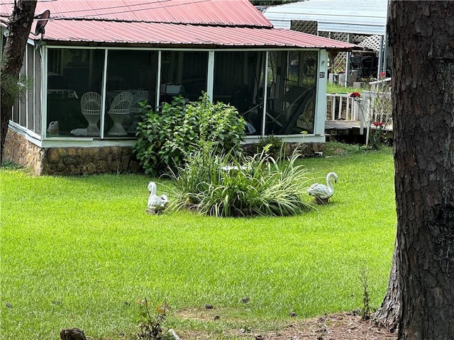 view of yard with a sunroom