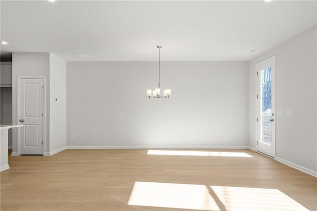 714 Smokey Quartz Way, Kennesaw, GA 30144 - unfurnished dining area with light wood-type flooring, a chandelier, baseboards, and recessed lighting