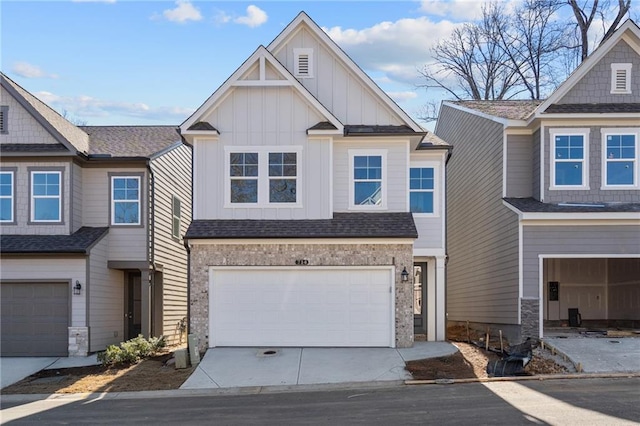 714 Smokey Quartz Way, Kennesaw, GA 30144 - view of front facade with board and batten siding, an attached garage, and driveway