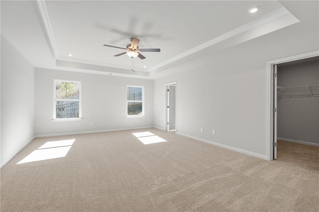 714 Smokey Quartz Way, Kennesaw, GA 30144 - unfurnished bedroom with a raised ceiling, a walk in closet, light carpet, ornamental molding, and recessed lighting