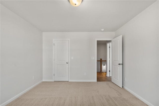 714 Smokey Quartz Way, Kennesaw, GA 30144 - unfurnished bedroom featuring baseboards and light colored carpet