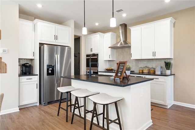 714 Smokey Quartz Way, Kennesaw, GA 30144 - kitchen with stainless steel refrigerator with ice dispenser, wall chimney exhaust hood, dark countertops, light wood-style flooring, and backsplash