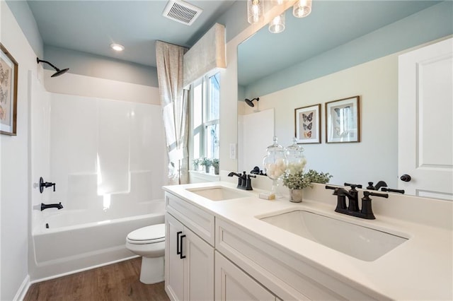 714 Smokey Quartz Way, Kennesaw, GA 30144 - bathroom featuring toilet,  shower combination, wood finished floors, double vanity, and recessed lighting
