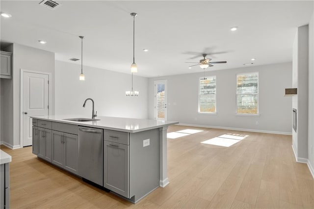 714 Smokey Quartz Way, Kennesaw, GA 30144 - kitchen featuring gray cabinetry, stainless steel dishwasher, a sink, baseboards, and light countertops
