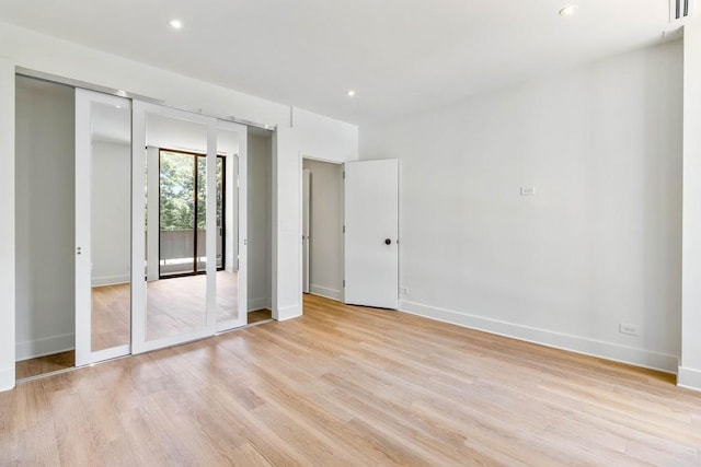 2575 Peachtree Rd NE Unit 6G, Atlanta, GA 30305 - unfurnished bedroom featuring light wood-style floors, baseboards, and recessed lighting