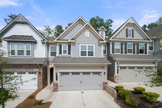 1025 Cherryfield Run, Marietta, GA 30008 - view of front facade featuring a garage, concrete driveway, and board and batten siding
