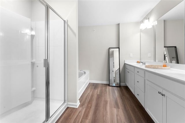 1025 Cherryfield Run, Marietta, GA 30008 - bathroom with a shower stall, wood finished floors, and double vanity