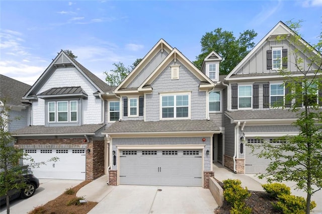 1025 Cherryfield Run, Marietta, GA 30008 - townhome / multi-family property featuring an attached garage, driveway, and stone siding