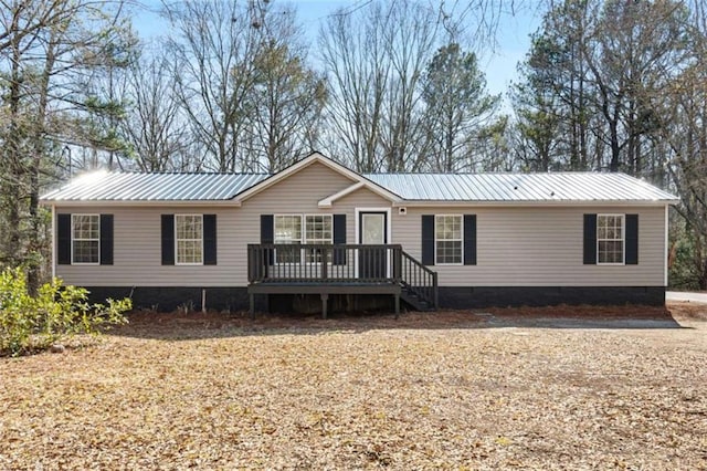 view of front of house featuring a wooden deck