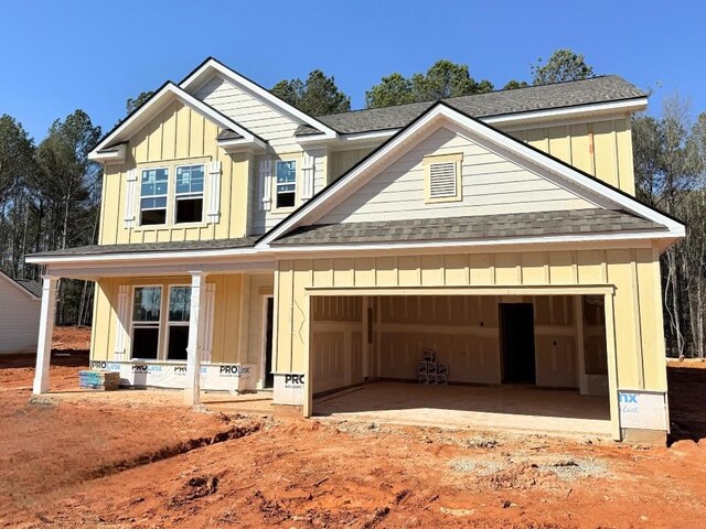 view of front of home featuring a garage and a front lawn