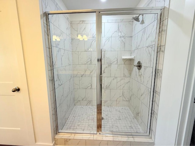 bathroom with a shower stall