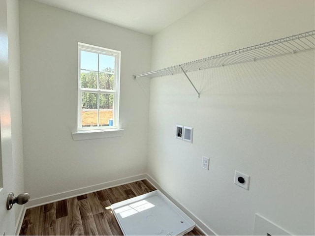 laundry area with laundry area, dark wood-type flooring, hookup for a washing machine, baseboards, and electric dryer hookup