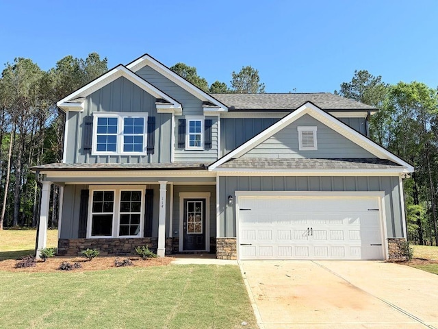 craftsman inspired home featuring board and batten siding, stone siding, and a front lawn