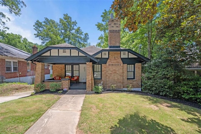 view of front of home featuring a porch and a front lawn