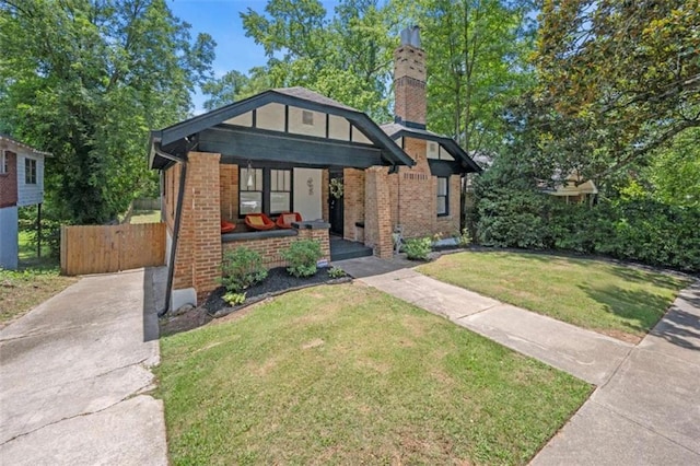 view of front of property with a porch and a front yard