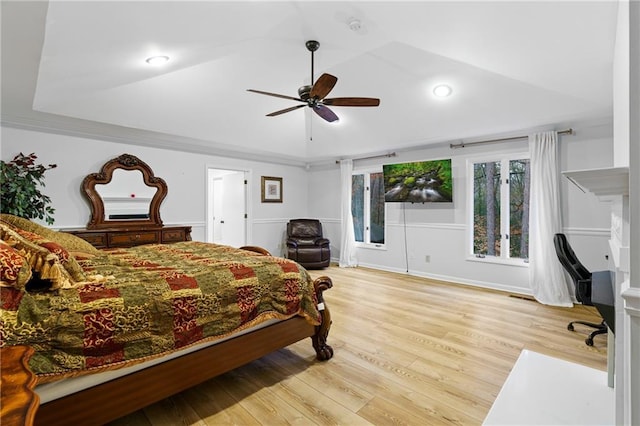 bedroom featuring a ceiling fan, light wood-style flooring, and lofted ceiling