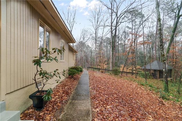 view of property exterior featuring fence