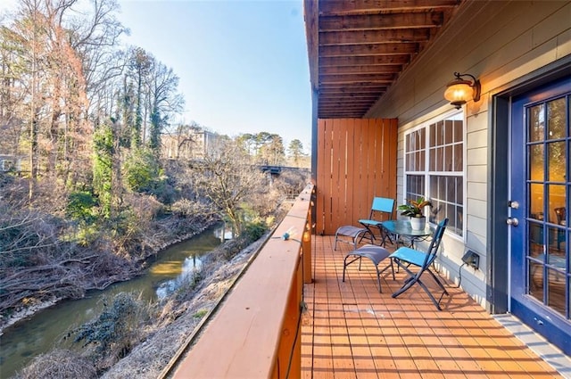 balcony featuring a water view