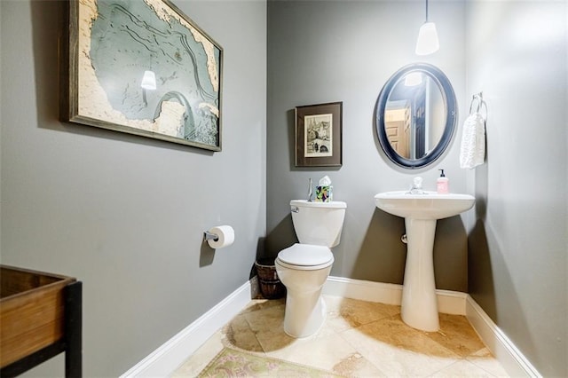 bathroom with tile patterned flooring and toilet