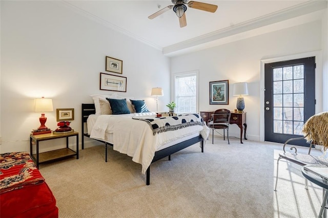 carpeted bedroom with multiple windows, crown molding, and ceiling fan