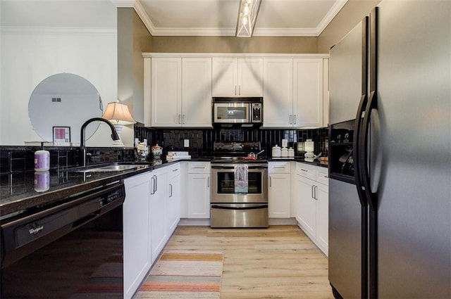 kitchen featuring white cabinetry, appliances with stainless steel finishes, and sink