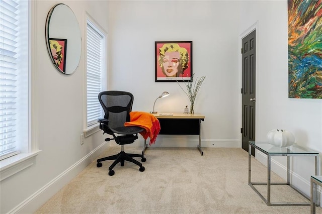 home office with light carpet and a wealth of natural light