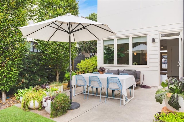 view of patio featuring outdoor dining area