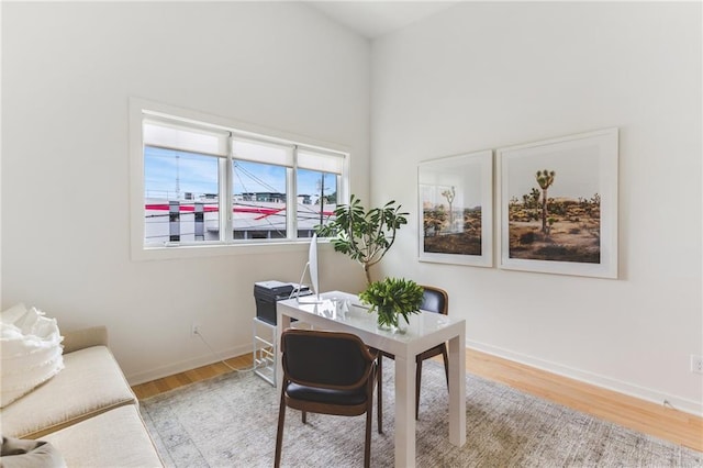 office area featuring baseboards and wood finished floors