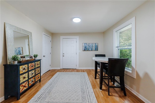 dining area with wood-type flooring