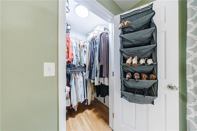 spacious closet featuring hardwood / wood-style flooring