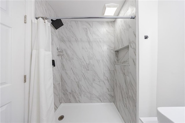 bathroom with a shower with shower curtain