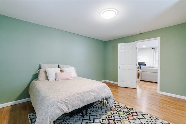 bedroom with wood-type flooring