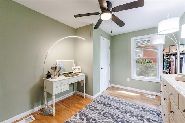 interior space with ceiling fan and light hardwood / wood-style floors