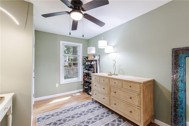 interior space with ceiling fan and light hardwood / wood-style flooring