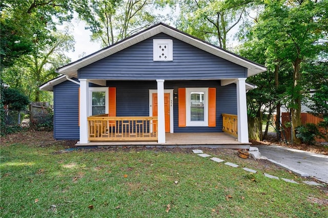 view of front of home with a front lawn and a porch