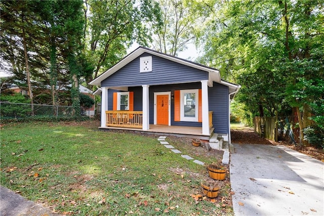 bungalow-style house with a porch and a front yard