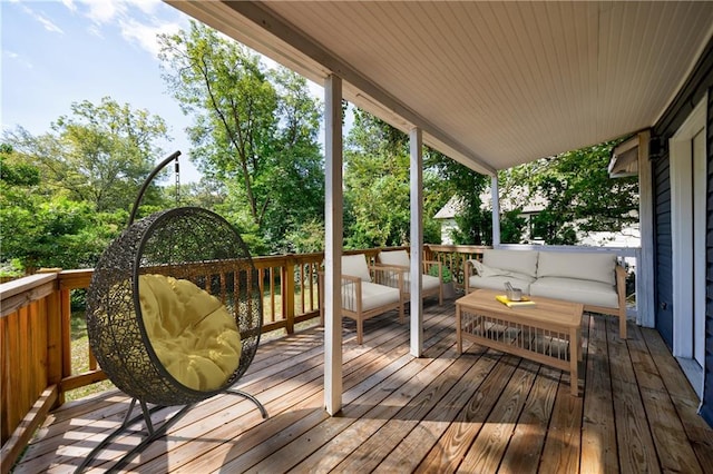 wooden terrace with an outdoor hangout area