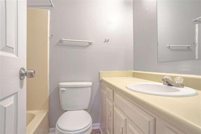 full bathroom with vanity, toilet, a tub to relax in, and a shower