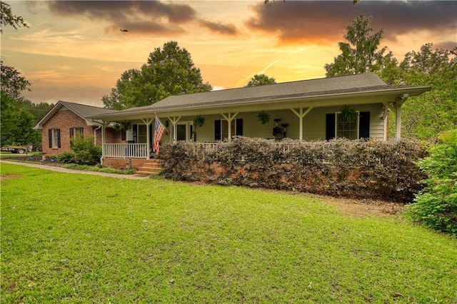 78 N Pomona Rd, Hampton, GA 30228 - ranch-style home with covered porch, a yard, and brick siding