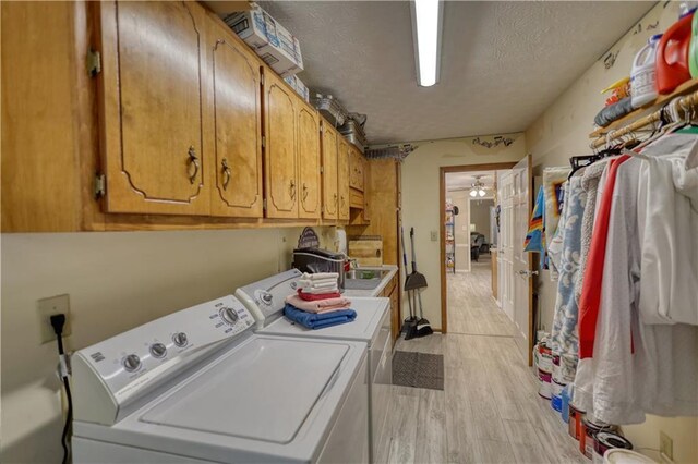 78 N Pomona Rd, Hampton, GA 30228 - washroom with washer and clothes dryer, cabinet space, light wood-style flooring, a textured ceiling, and ceiling fan