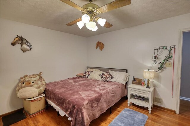78 N Pomona Rd, Hampton, GA 30228 - bedroom with wood finished floors, ceiling fan, and baseboards