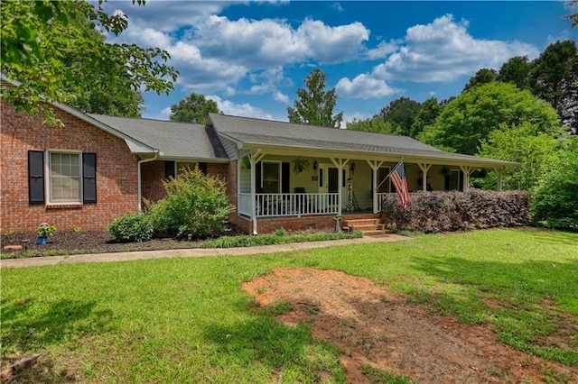 78 N Pomona Rd, Hampton, GA 30228 - ranch-style home with a porch, a front lawn, and brick siding