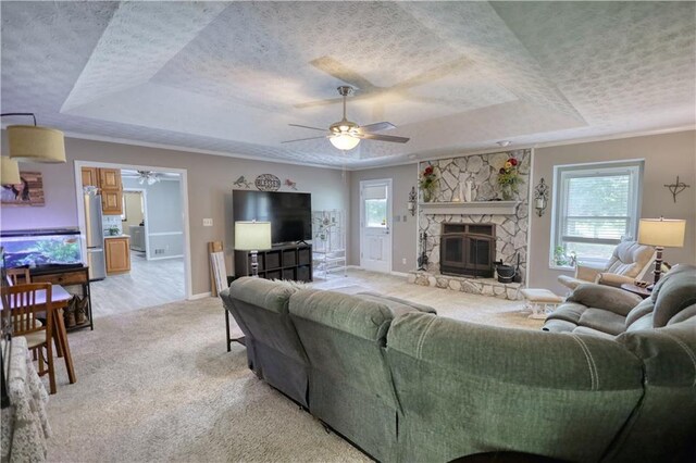 78 N Pomona Rd, Hampton, GA 30228 - living area featuring a tray ceiling, a ceiling fan, a textured ceiling, light carpet, and baseboards