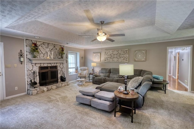 78 N Pomona Rd, Hampton, GA 30228 - living room with a raised ceiling, carpet, a textured ceiling, baseboards, and a fireplace