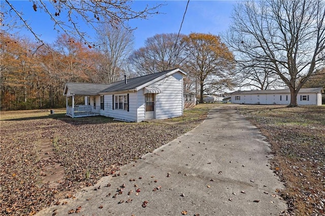 view of property exterior with covered porch